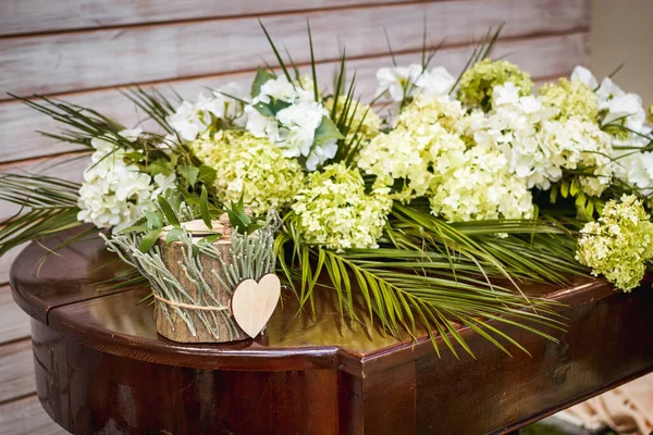 Wooden box for wedding rings on the table