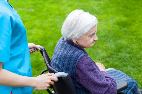 Senior Disabled Woman Wheelchair Walking Outdoor Female Caretaker — Stock Photo, Image