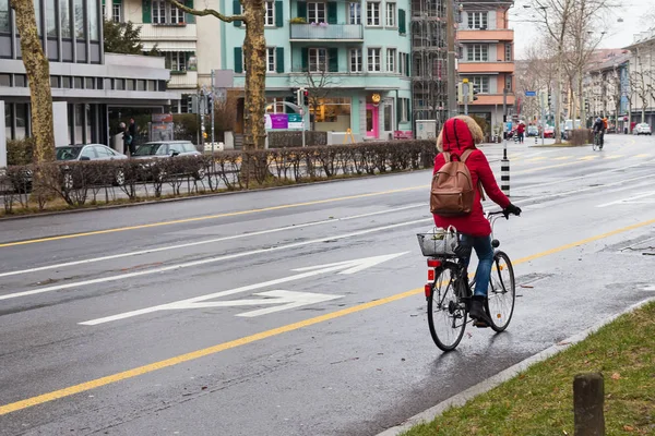 Female Red Coat Riding Bike Rainy Day Bern Switzerland — Stock Photo, Image