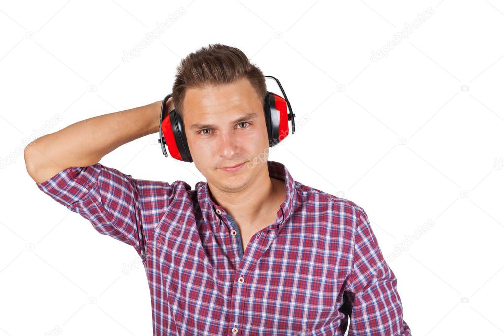 Young engineer on isolated background wearing noise cancelling headset