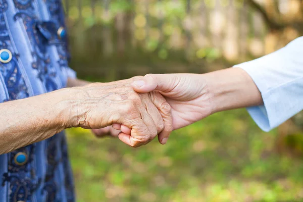 Close Picture Young Woman Holding Her Senior Grandmother Wrinkled Hands — Stock Photo, Image