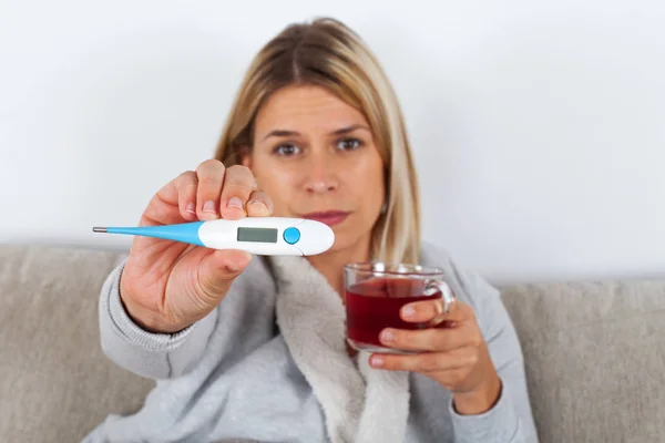 Sick Woman Sitting Couch Wrapped Warm Blanket Holding Hot Tea — Stock Photo, Image