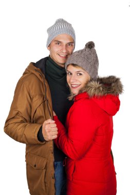 Genç çift kırmızı ve kahverengi kış ceket parka poz giymekte izole arka plan - mevsimlik moda giyim