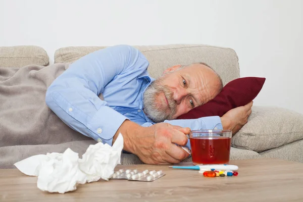Sick Senior Male Patient Lying Couch Home — Stock Photo, Image