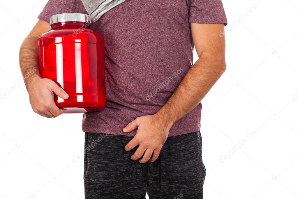  Close up picture of a young man holding a box of protein