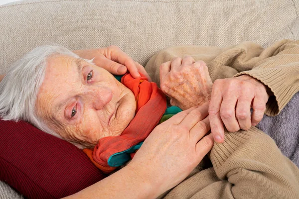 Close Picture Sick Elderly Woman Fever Resting Sofa Caregivers Hands — Stock Photo, Image