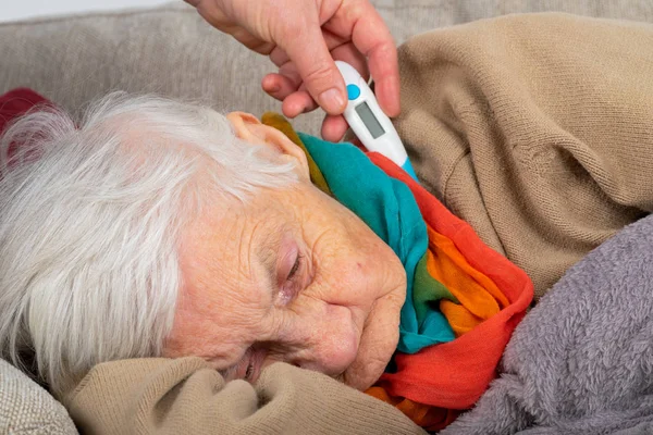 Sick senior woman - fever — Stock Photo, Image