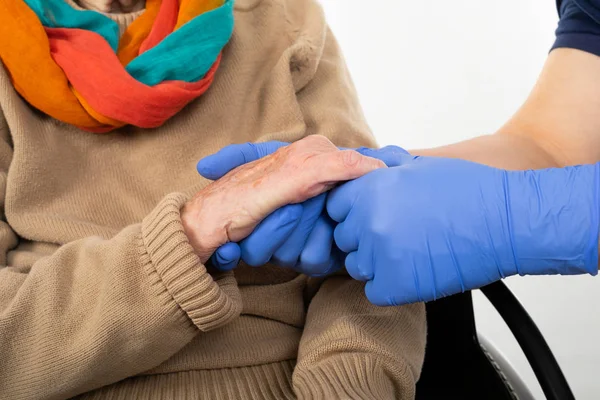 Nurse holding disabled woman's hands — Stock Photo, Image