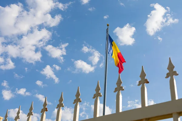 Iron fence and romanian flag