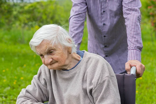 Old lady in wheelchair — Stock Photo, Image