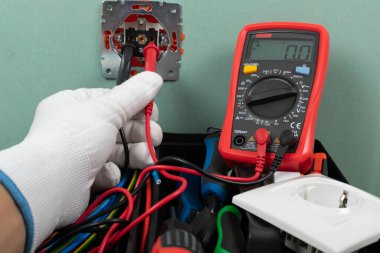 Tools for electrician needs: shocket multimeter, voltage testers, wire strippers, pliers, clipart