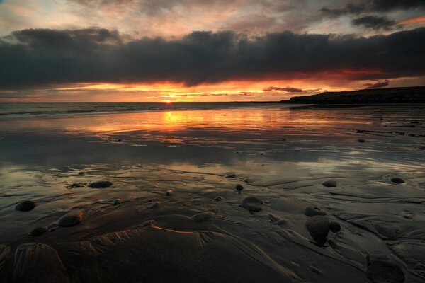 Stony coast at sunset in Iceland