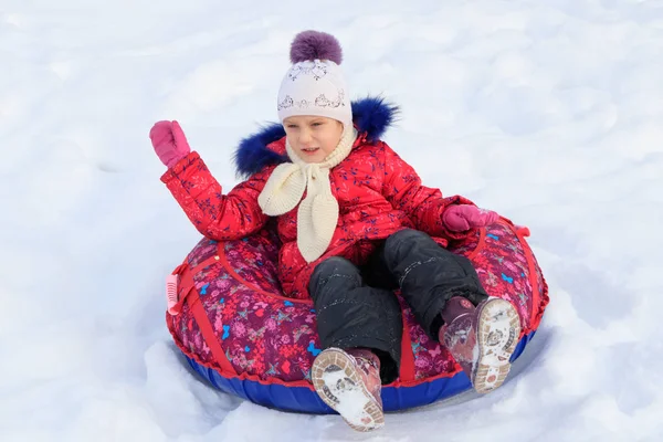 Girl Inflatable Sled Rides Snowy Slope — Stock Photo, Image