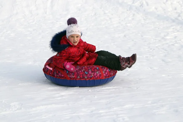 Girl Inflatable Sled Rides Snowy Slope — Stock Photo, Image