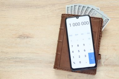 bize dolar ve numaraları ile birlikte 1 000 000 arka planda bir resepsiyon ile kopya alanı açık hesap makinesi ile Organizatör