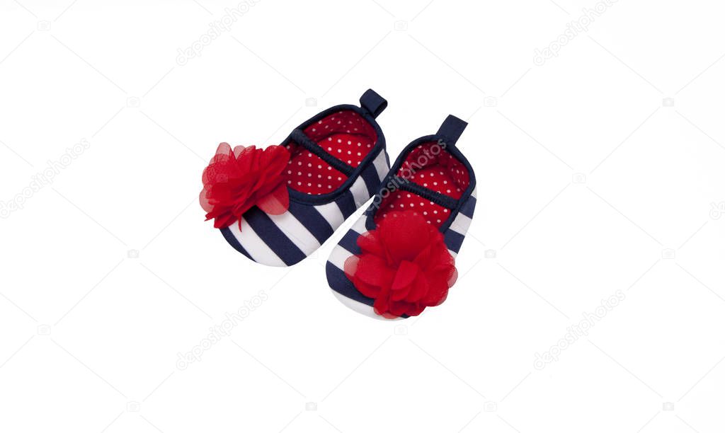 Pair of baby's striped shoes isolated on white background.