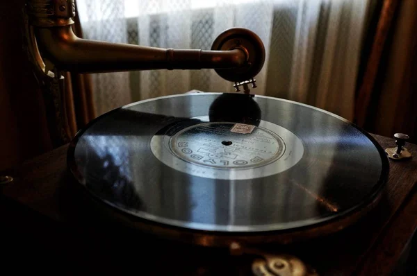 Vinyl record player. Sound technology for DJ to mix and play music. Black vinyl record. Vintage vinyl player. Vinyl record needle