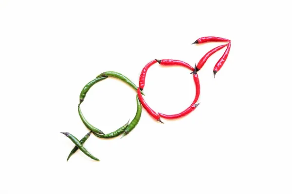 Male and female gender signs. made of red and green hot peppers on a light background.