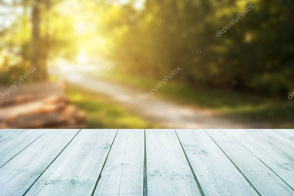 blue table on blurred forest road background-can be used to display or mount your product.Mockup template to display your product