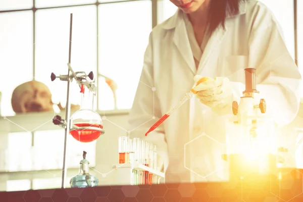 female scientists are experimenting in lab room