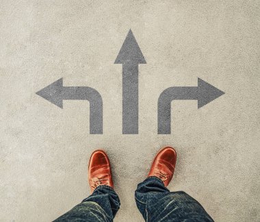 A man in brown leather shoes standing at the crossroad making decision which way to go, three ways to choose. hope and success concept. clipart