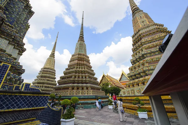 Tourist and Thai people visiting and taking photo at Wat Pho