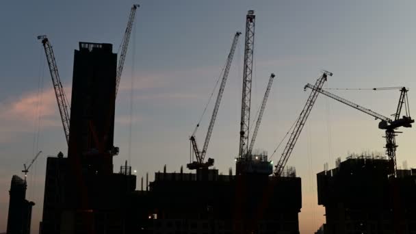 Time Lapse Sunset Silhouette Crane Working Construction Site — Stock Video