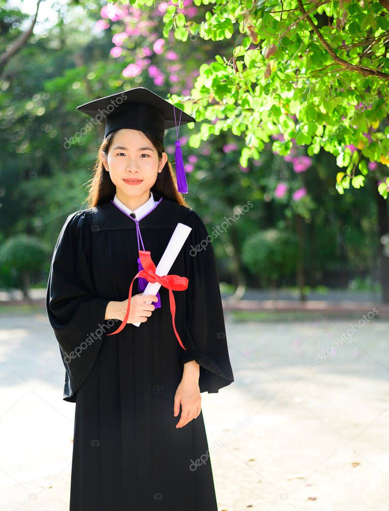 Pretty asian female college graduate at graduation