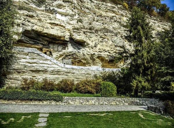 Foot-way from lithoidal flags at a foot ancient, multilevel rocky monastery.