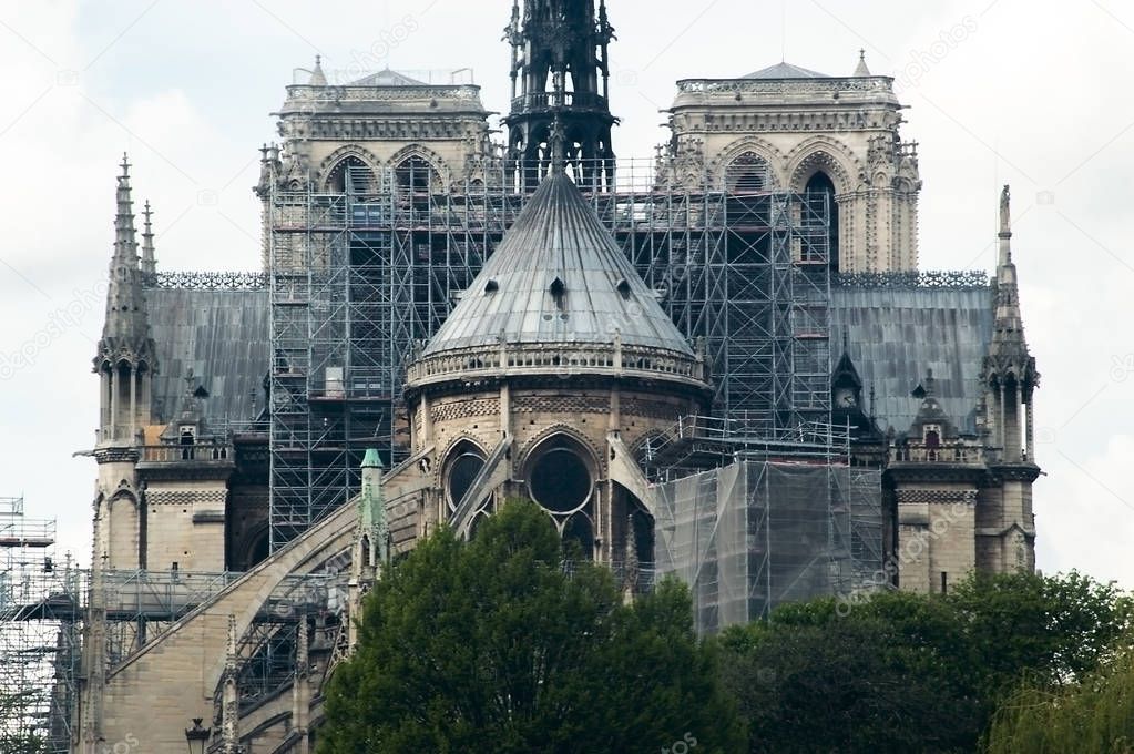 Rear of Notre Dame cathedral with renovation works and scaffoldi