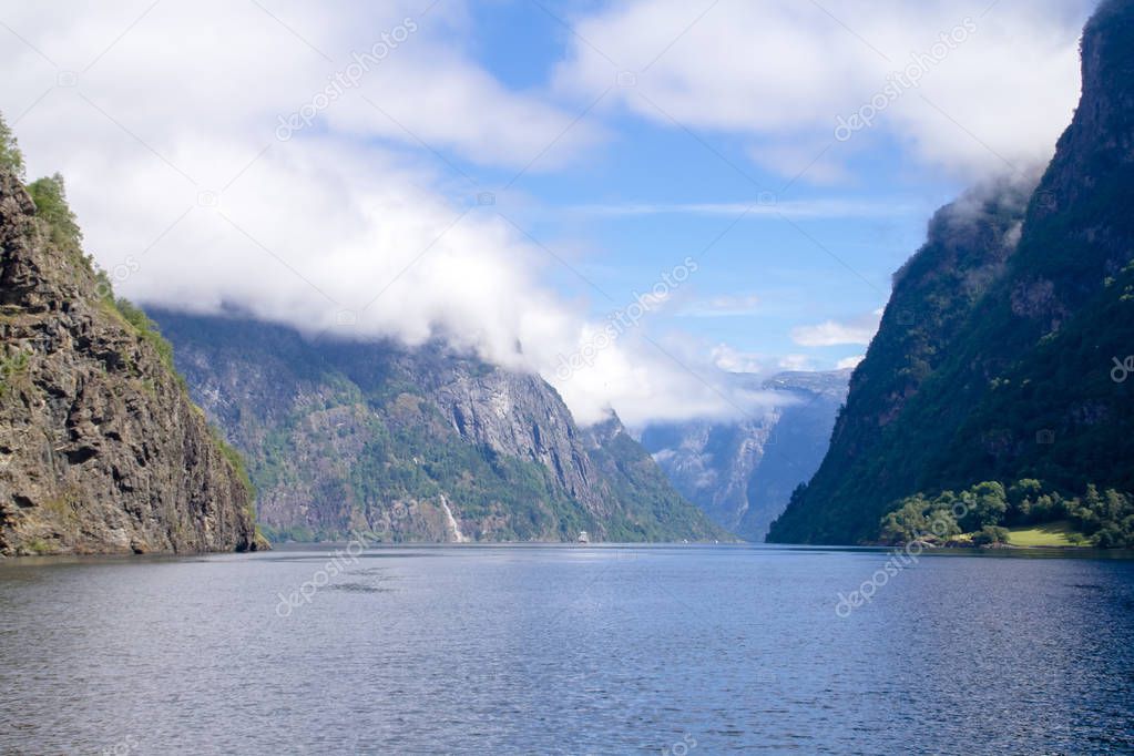 The coast of the Norwegian fjord during summer travels on a boat