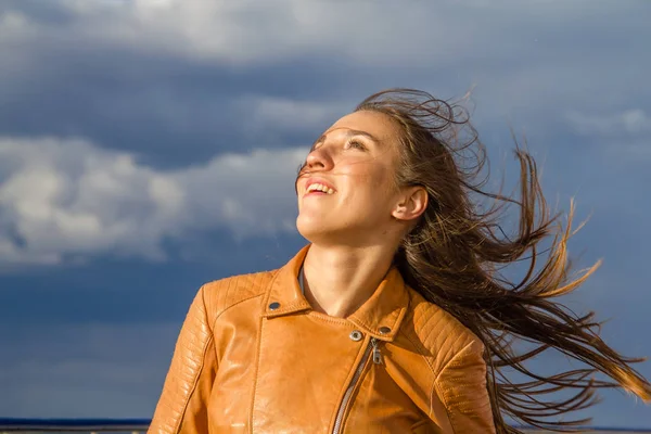 Young woman looking at the sky