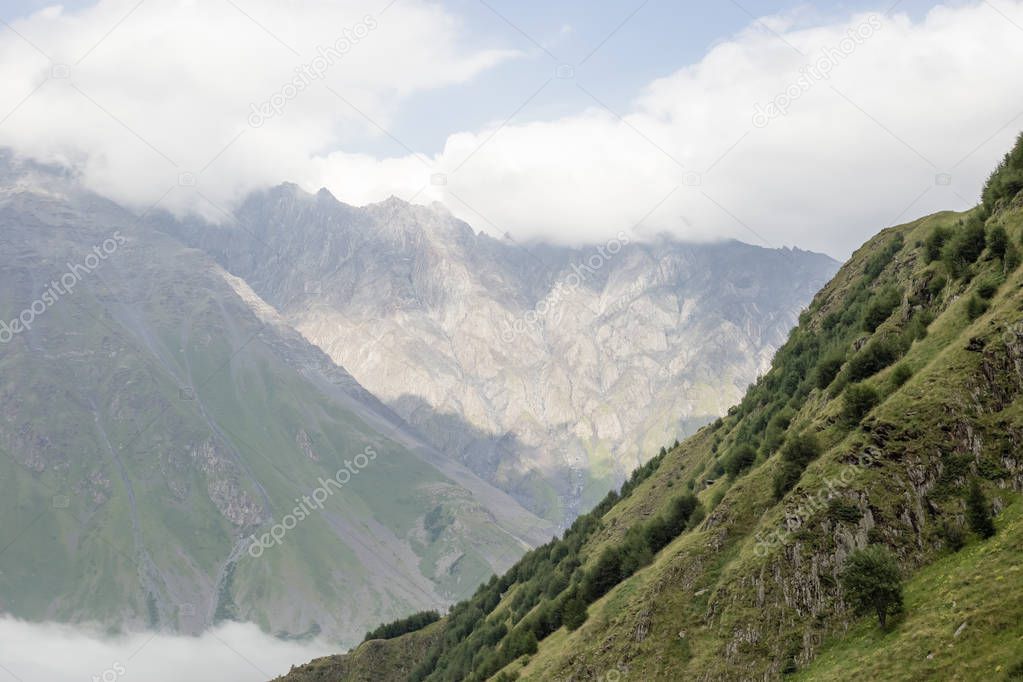 Landscape view of the Caucasus Mountains near Trinity Church in Gudauri. Georgia