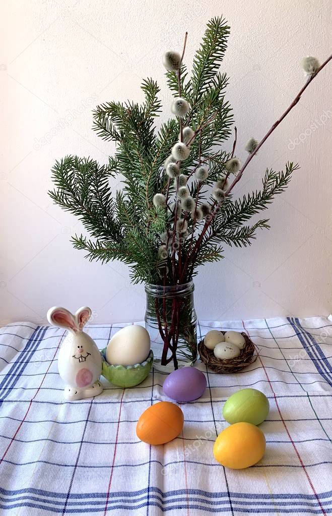 Festive table setting for Easter, colorful eggs