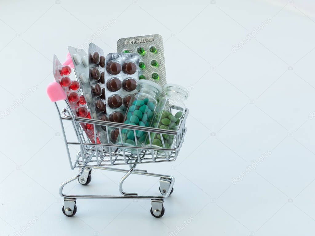 medicines in a shopping cart. The concept of buying medicines on the Internet, online, on the site, remotely