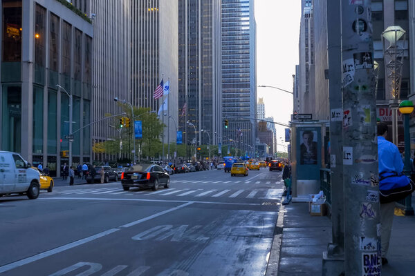 New York, USA - June 20, 2015: Walking through the streets of New York, Manhattan. The life of New York in the afternoon. Streets and city buildings.