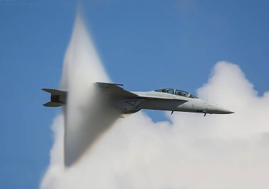 The fighter overcomes the sound barrier, the moment of transition of the sound barrier by plane. clipart