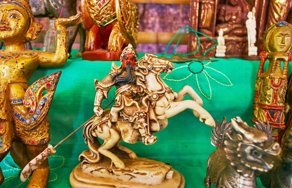 The antique ivory sculpture of Oriental equestrian warrior in the stall of tourist market of Indein (Inn Thein) village, Inle Lake, Myanmar.