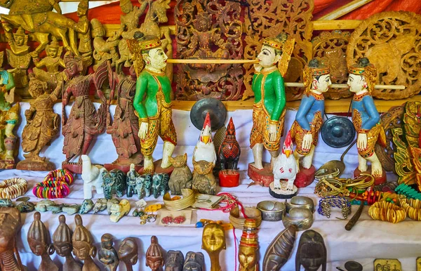 stock image Carved wooden sculptures in shape of birds, animals, people and deities in market of Indein (Inn Thein) village, Inle Lake, Myanmar.