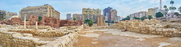 Panorama of Roman Auditorium with remains of ancient lecture halls and thermae (baths), surrounded by residential streets of Alexandria, Egypt.