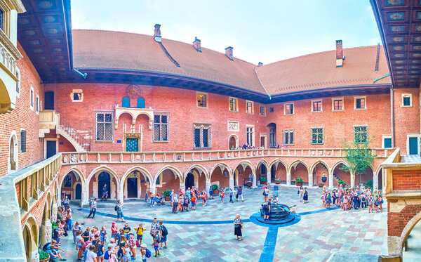 KRAKOW, POLAND - JUNE 11, 2018: The medieval courtyard of Collegium Maius of Jagiellonian University amazes with the scope of architectural thought, on June 11 in Krakow.