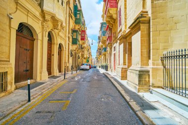 Doğal kireçtaşı yapılardır eski Valletta, Malta St Paul cadde kuyruğu.