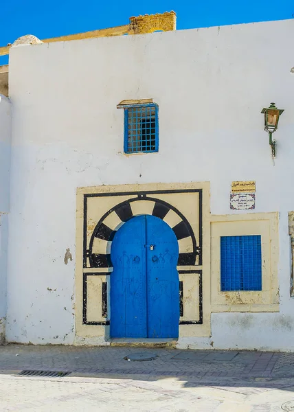Traditional Arabic horseshoe door of the old Mausoleum of Sidi Abid Ghariani, Kairouan, Tunisia.