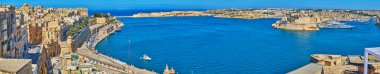 The view from St Peter and Paul Bastion on azure waters of Grand Harbour, medieval quarters of Valletta, Fort St Angelo of Birgu and Fort Ricasoli of Kalkara, Malta. clipart