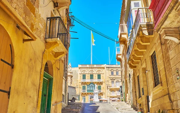 The narrow Nestu Laiviera ascent leads to the Victory Square (Misrah ir-Rebha) with statue of St Lawrence and preserved historical mansions, such as  Palazzo Huesca, Birgu (Vittoriosa), Malta.