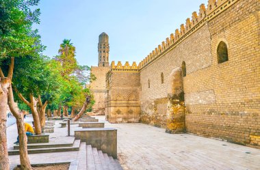 The huge medieval defensive walls of Mosque of al-Hakim, also known as al-Anwar, located in Islamic district of Cairo, Egypt clipart