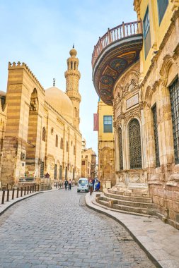 CAIRO, EGYPT - DECEMBER 23, 2017: The El-Muizz street is the main tourist street in Islamic Cairo with main landmarks on it, on December 23 in Cairo clipart