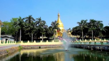 Büyük altın stupa, Yangon, Myanmar gizleme Maha Wizaya (Mahavijaya) Pagoda gür yeşilliklerle çevrili, gölet Çeşme.