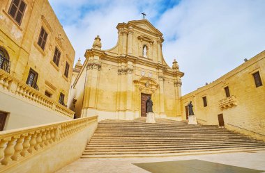 Ensemble of medieval Cathedral Square of Rabat Citadel with a view on Assumption Cathedral and old edifices, Victoria, Gozo Island, Malta. clipart