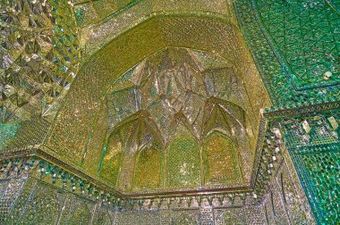 SHIRAZ, IRAN - OCTOBER 12, 2017: The carved niche with muqarnas details in Mirror Hall of Imamzadeh Ali Ibn Hamzeh Holy Shrine, on October 12 in Shiraz clipart